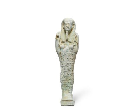  A large Egyptian light blue glazed composition shabti for General Pa-Khas Late Period, 30th Dynasty, circa 380-343 B.C.The m