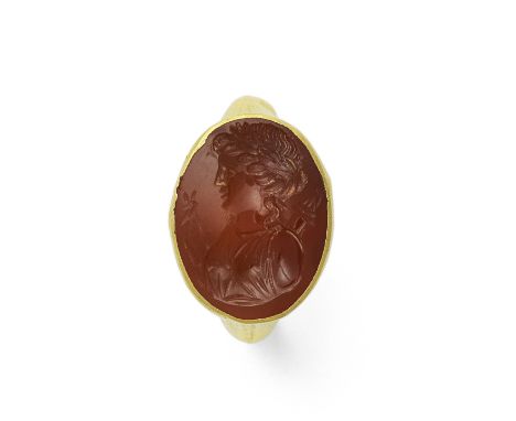  A Roman gold and carnelian intaglio ring with a bust of Artemis Circa 1st-2nd Century A.D.The hollow gold hoop set with an o