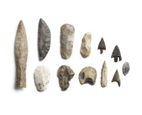  A Danish flint dagger and eleven Neolithic flint implements Late Neolithic, circa 2000-1700 B.C.The dagger of grey flint wit