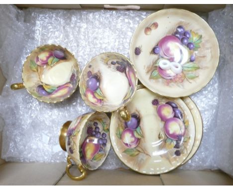 A Collection of Aynsley Orchard Gold Teaware to include Three Teacups and Saucers and One Small Footed Bowl 