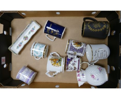 A mixed collection of items to include commemorative loving cups , Coalport Caughley mask head jug , Wedgwood tankard , Coalp