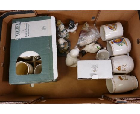 A mixed collection of items to include commemorative mugs, Beswick 1887 model of a cat, The leonardo collection resin figures