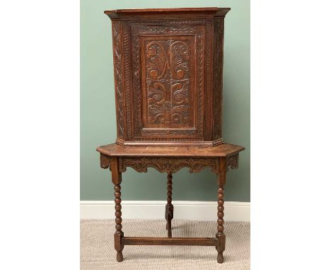 ANTIQUE CARVED OAK CORNER CUPBOARD on stand, with carved apron and bobbin supports, 166cms H, 98cms W, 58cms D