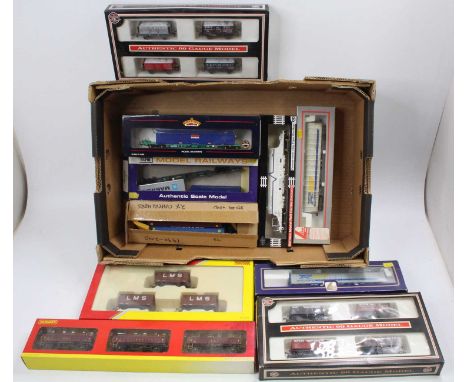 One tray containing a quantity of various 00 gauge goods, rolling stock and accessories to include wagon triple and quad pack