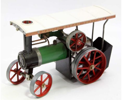 A Mamod TE1A traction engine of usual specification with burner and scuttle, together with original steering rod