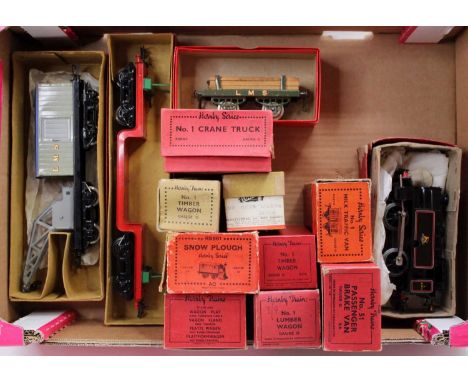 Large tray containing one loco and ten goods wagons: 1954-60 Type 40 BR 0-4-0 clockwork tank loco 82011  ‘Lion over Wheel’ (V