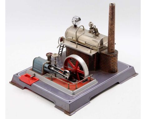 A Wilesco stationary steam plant comprising of horizontal boiler powering a single cylinder mill engine with slip eccentric p