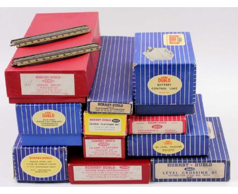 A large box of Hornby-Dublo accessories: 5020 Goods Depot kit, plain red box; 5030 Island Platform kit, plain red box; anothe