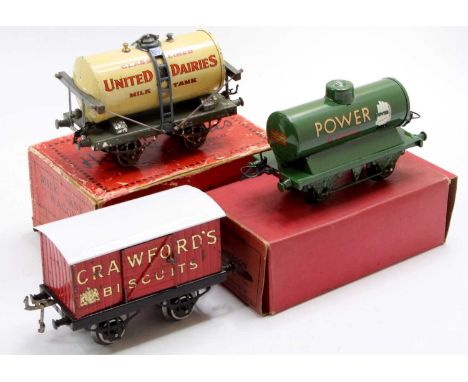 Three Hornby 0-gauge wagons: United Dairies milk tank, open axleguard ‘olive green’ base, white tank, blue ladder, might be a
