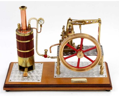 A well engineered stationary steam plant comprising of spirit fired vertical boiler, wooden clad example with burner and stea
