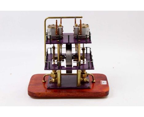 Scratchbuilt twin cylinder marine engine, of vertical formation with centrally situated 4.5 inch fly wheel, raised on heavy b