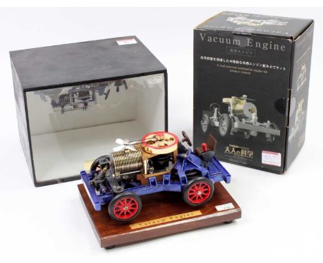 Gakken of Japan, kit built Vacuum Engine 4 wheel car, of usual specification, hand painted in blue with red hubs, complete wi
