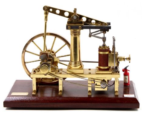 An all brass scale model of a live steam beam engine, fitted with a 12V DC Drive motor to underside, model is built to a very