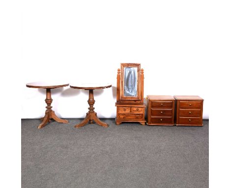 Pair of bleached mahogany three-drawer table top chests, along with a toilet mirror and two small circular tables.