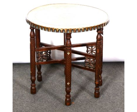 An antler gong; and a wooden table with brass top, mother-of-pearl inlay to legs.Qty: 2