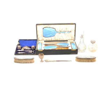 A seven-piece silver-backed manicure set, Walker &amp; Hall, London 1905, in fitted case; a blue enamel and silver-backed dre