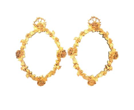 Pair of gilt metal girandoles, early 20th century, the frames cast with rose heads, berries and vines, mounted with two scrol