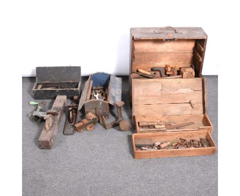 Quantity of old hand carpenters tools, scythe, wood plane etc, in a fall-front stained pine chest.