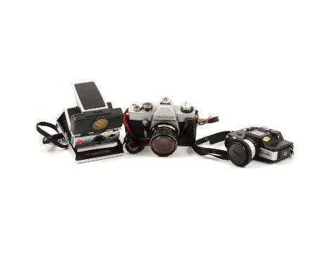 Vintage film cameras, three including Polaroid SX-70 folding instant camera; Praktica LLC camera with 1.8/50mm lems; Minolta 