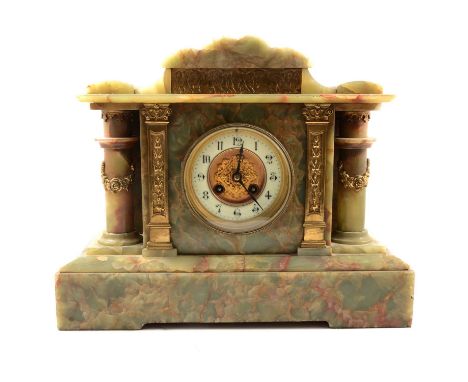 Victorian onyx mantel clock, circular dial, French cylinder movement striking on a gong, height 31cm.