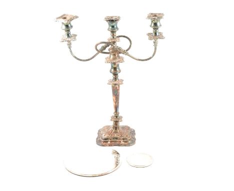 Three-light silver plated candelabra and a set of plated coasters.