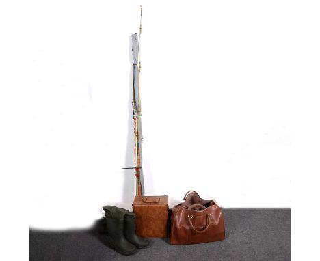 A collection of sea fishing rods, reels, hooks, weights, other items; pair of waders; and a hunting cartridge case.