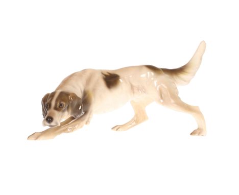A GOLDSCHEIDER MODEL OF A HOUND, black printed factory mark and impressed numbers. 31.5cm