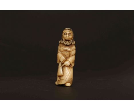 A JAPANESE CARVED HORN NETSUKE, PROBABLY LATE 18th/EARLY 19th CENTURY, of a Dutchman, holding a ham shank. 61mm