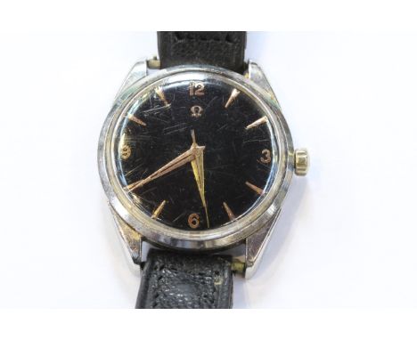 A VINTAGE OMEGA BLACK DIAL WRIST WATCH, with centre sweep seconds. Case diameter 33mm