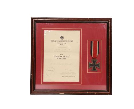 A WORLD WAR II GERMAN ARMY IRON CROSS SECOND CLASS, with ribbon, framed with original citation to Unteroffizier Alfred Kreiss