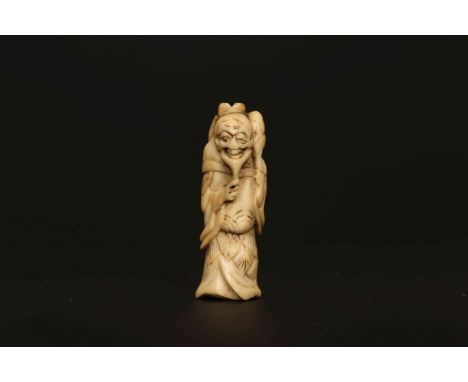 A JAPANESE IVORY NETSUKE, PROBABLY LATE 18th/EARLY 19th CENTURY, of a standing sennin. 61mm