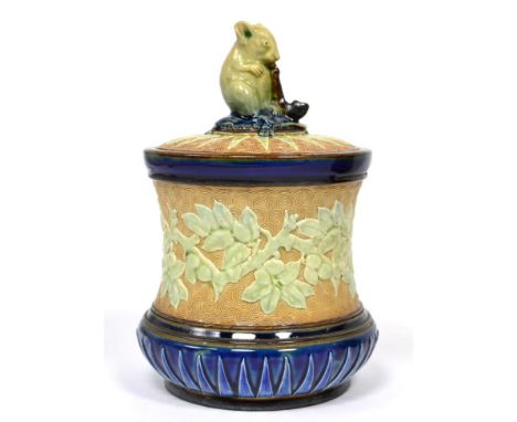 A Doulton Lambeth Stoneware Tobacco Jar, attributed to George Tinworth, with applied moulded fruiting branches on a buff grou