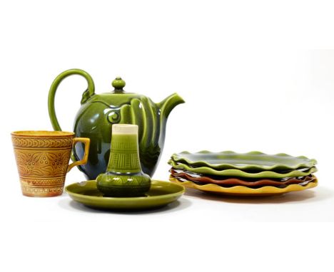 A Linthorpe Pottery Teapot, olive glaze, impressed LINTHORPE 1246, 13.5cm Four Linthorpe Pottery Plates, various patterns and