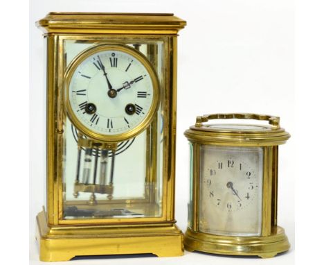 A gilt brass four glass mantel clock; together with an oval gilt brass carriage clock (one side panel lacking) (2)