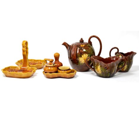 A Linthorpe Pottery Three Piece Teaset, decorated with daisies and butterflies, impressed LINTHORPE 1246/1039/1038 and painte