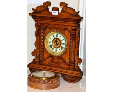 An Ansonia clock and a barometer in a rope twist frame 