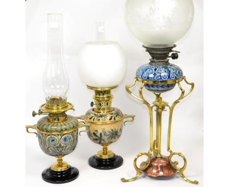 A Doulton Lambeth Stoneware Oil Lamp, decorated by Edith Lupton with incised flowers, brass fittings, on a black socle base, 