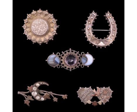 Five Victorian and later silver / white metal brooches including an amethyst and agate, horseshoe, ivy leaf engraved target a