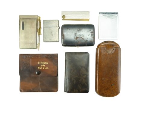 A group of vintage personal pocket objects including a leather cigar case, an address book, a notepad, a postage stamps holde