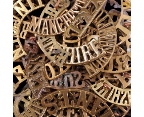A group of British Army metal shoulder titles