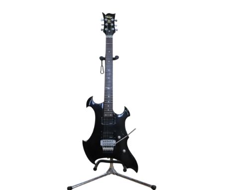 A JHS Vintage Metal Axxe Wraith electric guitar together with a yellow Thomenn guitar case
