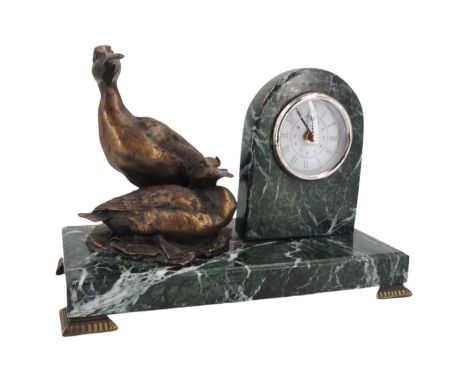 A contemporary bronzed and variegated green marble table or mantle clock by Smith of London, having a quartz movement set int