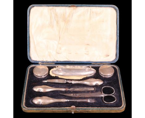 A cased George V silver mounted manicure set, Green &amp; Cadbury Ltd, Birmingham, 1918 (scissors associated )