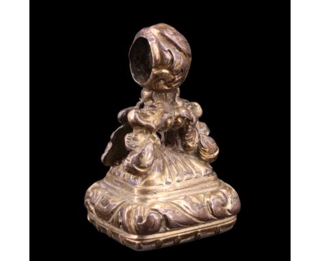 A late Georgian / Victorian rolled gold fob seal breloque, its matrix bearing the aphorism "We Bloom Today. Tomorrow Die" and