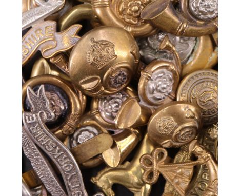 A group of West Yorkshire Regiment and Kings Own Yorkshire Light Infantry cap and collar badges etc