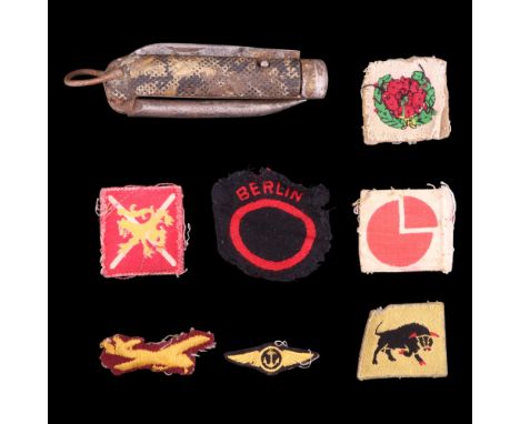 A small group of British Army cloth insignia including 4th Infantry Division, 11th Armoured Division and Berlin Command forma