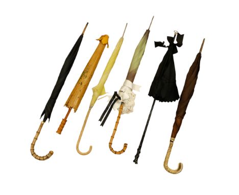 A group of five vintage umbrellas together with a Japanese parasol
