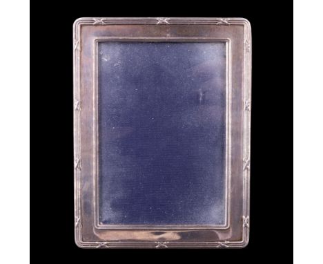 A 1999 silver photograph frame, having a ribbon-tied-reeds edge moulding, 10.5 cm x 8 cm
