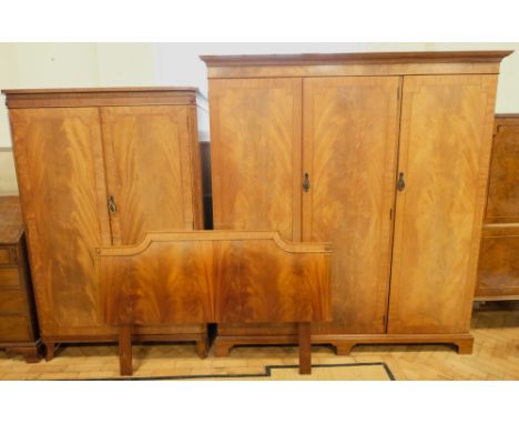 A quality mahogany bedroom suite, comprising two wardrobes and a double bedhead, 3 door wardrobe 171 x 63.5 x 183 cm, 2 door 