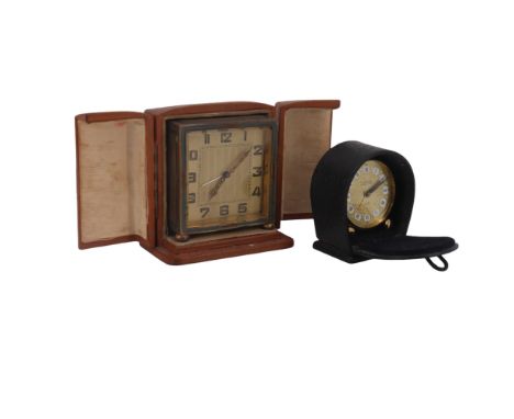 A 1920s-1930s lacquered and engraved brass boudoir or travel alarm clock, in fitted leather case, (a/f), together with a late